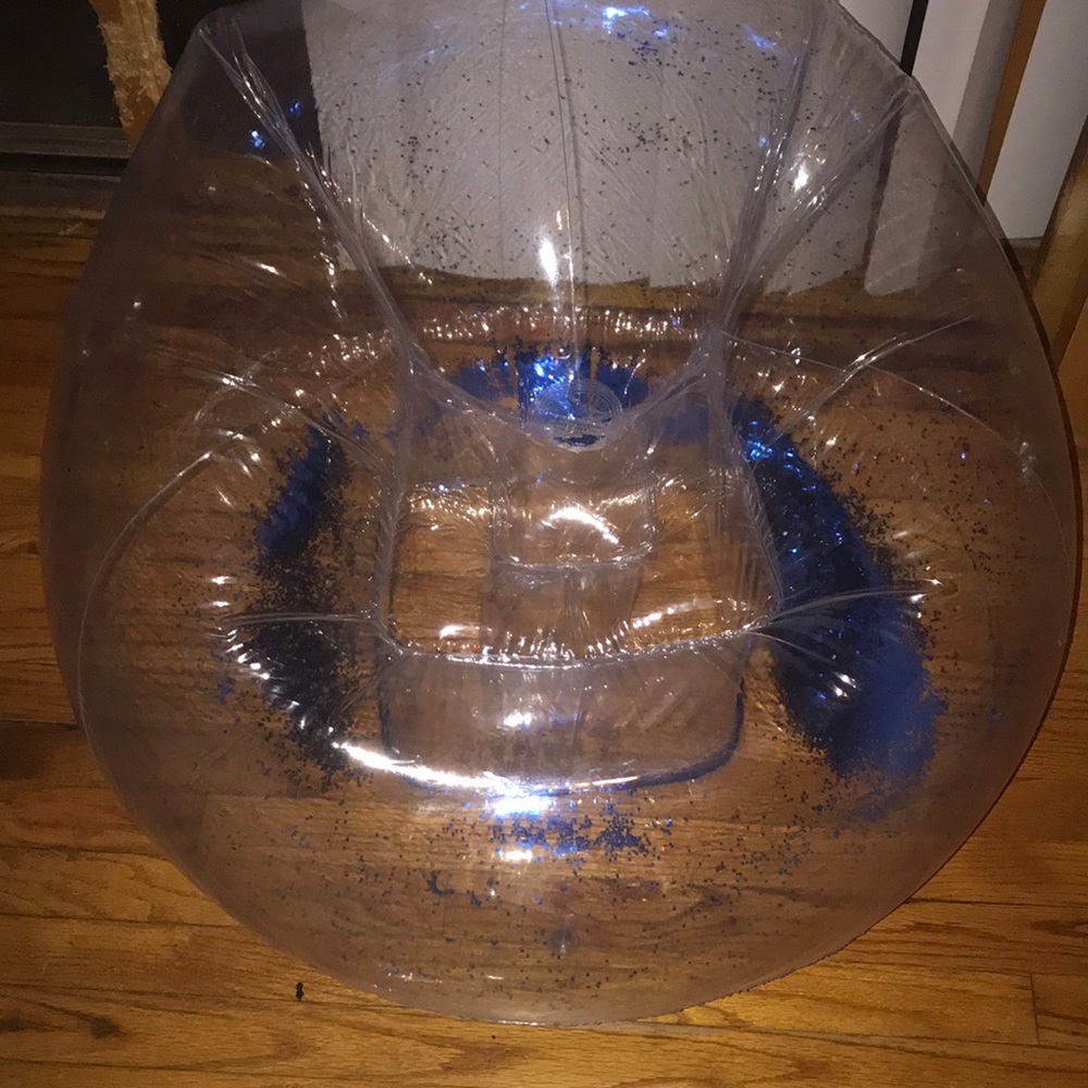 A full blow up chair, glitter in side of it.